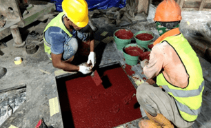 Chockfast Grouting Compounds Increase Foundation Service Life at Cement Plant Installation of Chockfast Red into concrete foundation