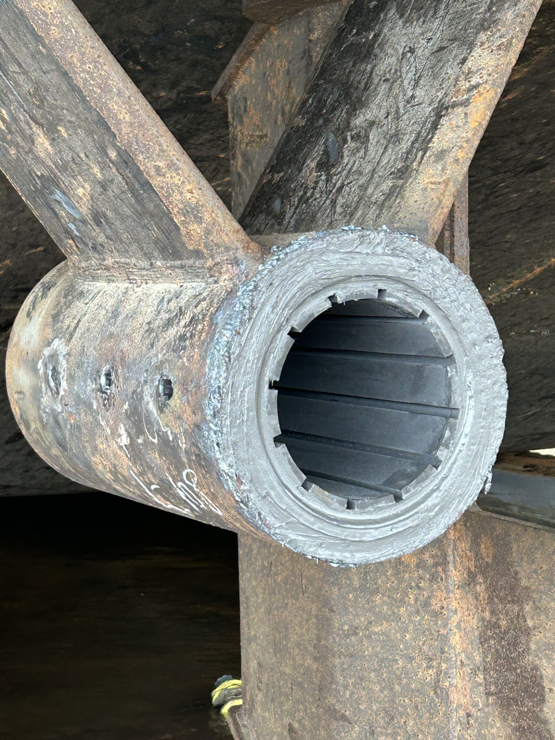 Bearing installed in housing with Devcon Plastic Steel Putty (A)
