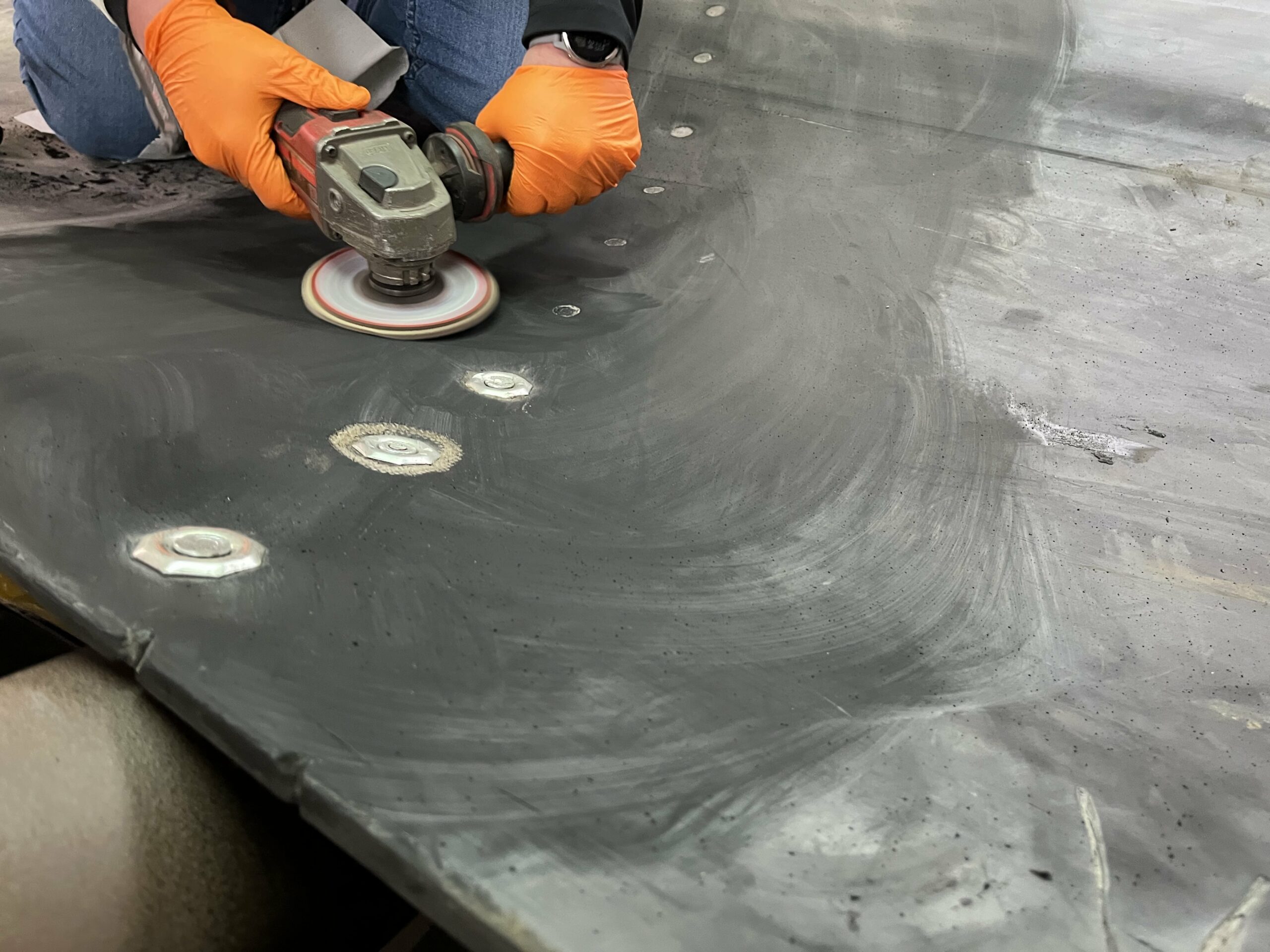 Surface abrasion with abrasive wheel
